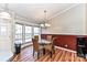 Bright dining area with glass table, wicker chairs, and a chandelier at 8327 Walkup Rd, Waxhaw, NC 28173