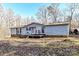 Ranch style home with deck and wooded backdrop at 8327 Walkup Rd, Waxhaw, NC 28173