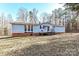 Ranch style home with deck and wooded backdrop at 8327 Walkup Rd, Waxhaw, NC 28173