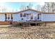 Ranch style home with deck and wooded backdrop at 8327 Walkup Rd, Waxhaw, NC 28173