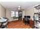 Home office features wood-look floors, built-in shelving, and a desk at 8327 Walkup Rd, Waxhaw, NC 28173