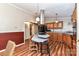 Open kitchen featuring wood cabinets, an island, and a breakfast bar at 8327 Walkup Rd, Waxhaw, NC 28173