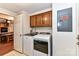 Convenient laundry room with washer, dryer, and overhead cabinets at 8327 Walkup Rd, Waxhaw, NC 28173