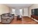 Living room with bay window and hardwood floors at 8327 Walkup Rd, Waxhaw, NC 28173