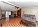 Living room with stone fireplace and hardwood floors at 8327 Walkup Rd, Waxhaw, NC 28173