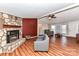 Living room with stone fireplace and hardwood floors at 8327 Walkup Rd, Waxhaw, NC 28173