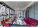 Relaxing screened porch with ceiling fan and two swings at 8327 Walkup Rd, Waxhaw, NC 28173