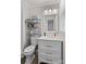 Clean bathroom with white vanity and a shower/tub combo at 111 Lois Ct, Statesville, NC 28625