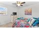 Spacious bedroom with ceiling fan and colorful bedding at 111 Lois Ct, Statesville, NC 28625