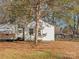 White single story home nestled among trees with a travel trailer in the yard at 113 Barron Park, York, SC 29745