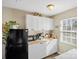 Bright kitchen boasting white cabinets and a spacious countertop at 113 Barron Park, York, SC 29745