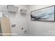 Laundry room with shelving, ironing board, and stylish wall art at 1374 6Th Ne St, Hickory, NC 28601