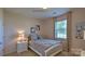 Well-lit bedroom featuring a double bed and decorative artwork at 1378 6Th Ne St, Hickory, NC 28601