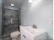 Clean bathroom with gray tile shower and white vanity at 1934 Hickory Hills Dr, Denver, NC 28037