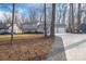 Two-story house with gray siding, two-car garage, and mature trees at 1934 Hickory Hills Dr, Denver, NC 28037