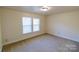 Well-lit bedroom with neutral walls and carpet at 2138 Durand Rd, Fort Mill, SC 29715