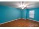 Well-lit bedroom with hardwood floors and ceiling fan at 2138 Durand Rd, Fort Mill, SC 29715
