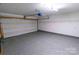 Spacious garage with epoxy flooring and overhead storage at 2138 Durand Rd, Fort Mill, SC 29715