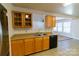 Kitchen with wood cabinets, double sink, and dishwasher at 2138 Durand Rd, Fort Mill, SC 29715