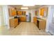 L-shaped kitchen with wood cabinets and stainless steel appliances at 2138 Durand Rd, Fort Mill, SC 29715
