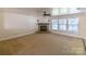 Living room with stone fireplace and large windows at 2138 Durand Rd, Fort Mill, SC 29715