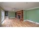 Gathering room with a brick fireplace and laminate floors at 218 Kingsway Cir, Charlotte, NC 28214