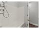 Simple bathroom with shower/tub and access to another room at 304 Shady Ln, Norwood, NC 28128