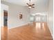 Open living room with hardwood floors and views to kitchen and dining areas at 5315 Hackberry Sw Ln, Concord, NC 28027