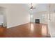 Hardwood floor living room with fireplace and vaulted ceiling at 5315 Hackberry Sw Ln, Concord, NC 28027