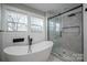 Elegant bathroom with soaking tub, walk-in shower, and modern fixtures at 5776 Reepsville Rd, Vale, NC 28168