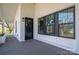 Front porch with black door and window features at 5776 Reepsville Rd, Vale, NC 28168