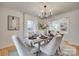 Bright dining room with chandelier and seating for six at 605 Ferndale Dr, Rock Hill, SC 29730