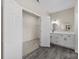 Bathroom with walk-in closet and double vanity at 7510 Water Oak Ln, Monroe, NC 28110