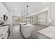 Modern kitchen with island, white cabinetry, and stainless steel appliances at 7510 Water Oak Ln, Monroe, NC 28110