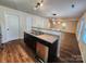 Kitchen features dark cabinets, stainless steel appliances and an island at 7917 E Lane Dr # 64, Charlotte, NC 28212