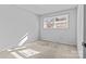 Well lit bedroom with neutral walls and carpet at 800 Peachtree Rd, Charlotte, NC 28216