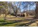 Brick ranch house with large backyard and mature trees at 800 Peachtree Rd, Charlotte, NC 28216