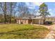 Rear view of house showing carport and large yard at 800 Peachtree Rd, Charlotte, NC 28216