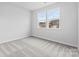 Spacious bedroom with gray carpeting and large windows at 809 Hallman Branch Ln, Lincolnton, NC 28092