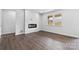 Living room with hardwood floors and fireplace, near kitchen at 809 Hallman Branch Ln, Lincolnton, NC 28092