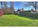 Landscaped backyard with green grass and fence at 9302 Brown Gelly Dr, Huntersville, NC 28078