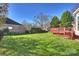 Large backyard with green grass and deck at 9302 Brown Gelly Dr, Huntersville, NC 28078