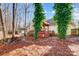 Landscaped backyard with stone pathway, gazebo, and mature trees at 952 Hummingbird Ln, Rock Hill, SC 29732