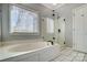 Relaxing bathroom featuring a soaking tub and a separate shower at 952 Hummingbird Ln, Rock Hill, SC 29732