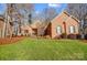 Brick home with landscaped lawn and mature trees at 952 Hummingbird Ln, Rock Hill, SC 29732