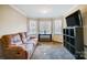 Relaxing Gathering room featuring a cozy sitting area and large windows at 952 Hummingbird Ln, Rock Hill, SC 29732