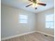 Bedroom with ceiling fan and two bright windows at 104 Barbee Sw Rd, Concord, NC 28027