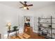 Home office with hardwood floors, built-in shelving, and natural light at 14132 Green Birch Dr, Pineville, NC 28134