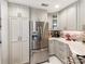 Stainless steel refrigerator and light gray cabinets in this updated kitchen at 18015 Kings Point Dr # F, Cornelius, NC 28031