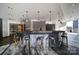 Community bar with barstools and pendant lighting at 210 N Church St # 1213, Charlotte, NC 28202